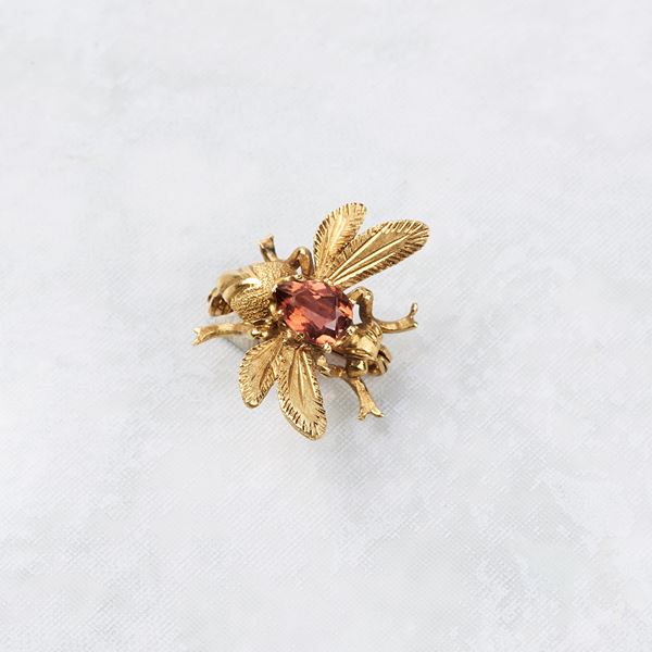 



SPILLA IN ORO GIALLO 18KT E PIETRA