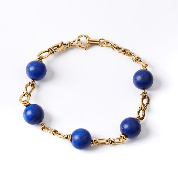 



BRACCIALE IN ORO GIALLO 18KT E LAPISLAZZULO