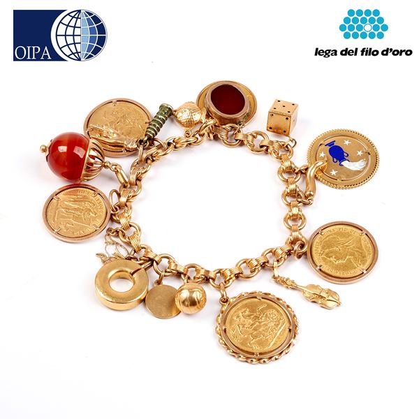 



BRACCIALE IN ORO GIALLO 18KT, CHARMS E MONETE