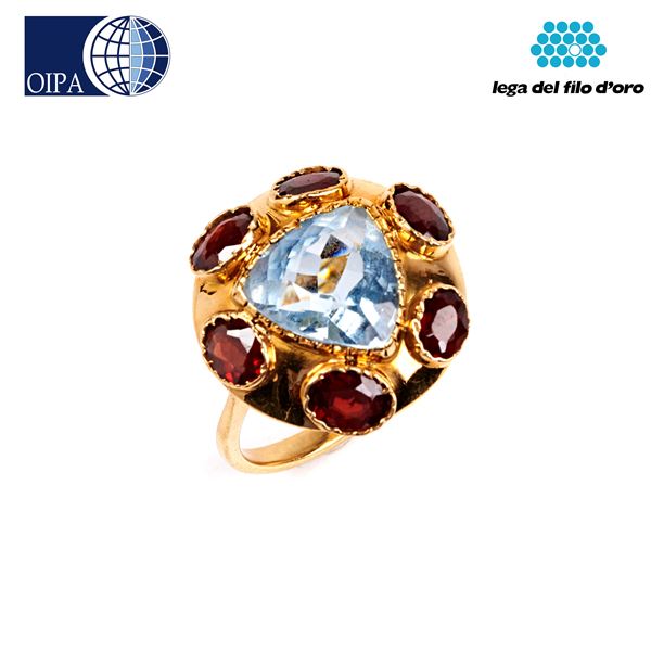 



ANELLO IN ORO GIALLO 18KT, TOPAZIO E GRANATI