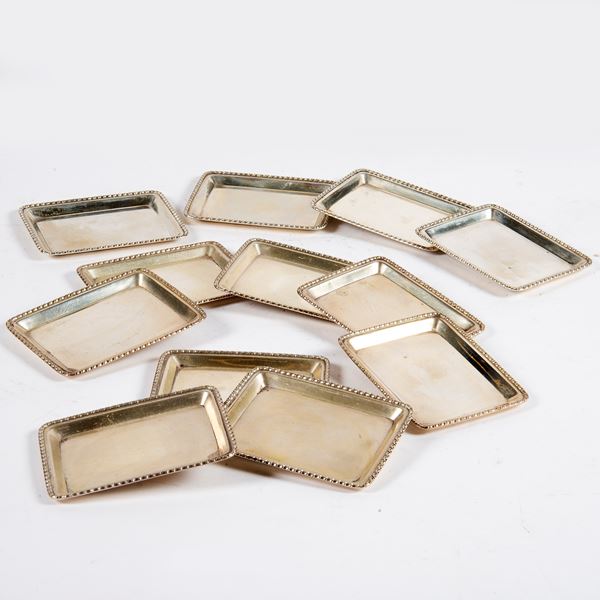 



Dodici vassoietti di forma rettangolare, sec. XX