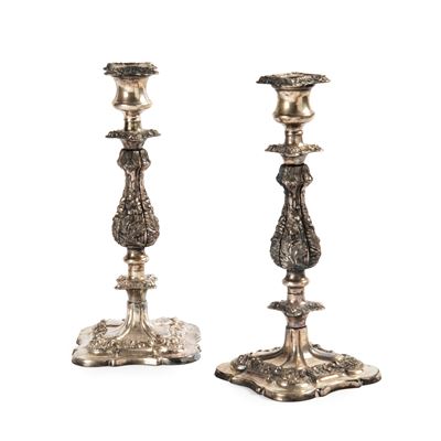 Coppia di candelabri, metallo argentato sbalzato, altezza cm 71, Secolo XX