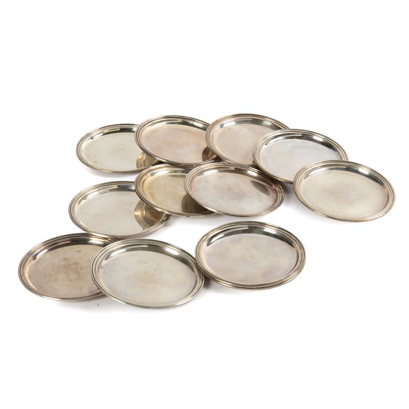 Dodici Sottobottiglia, Secolo XX, Argento, Diametro cm 12