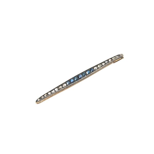 



SPILLA IN ORO 18KT , ARGENTO DIAMANTI E ZAFFIRI  - Asta GIOIELLI, OROLOGI E ARGENTI - Poggio Bracciolini Casa d'Aste
