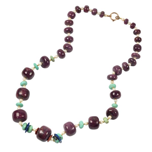 



COLLANA DI PIETRE E PERLE 