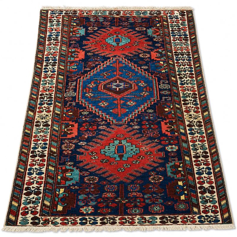 Tappeto persiano, sec. XX, fondo blu con tre borchie centrali