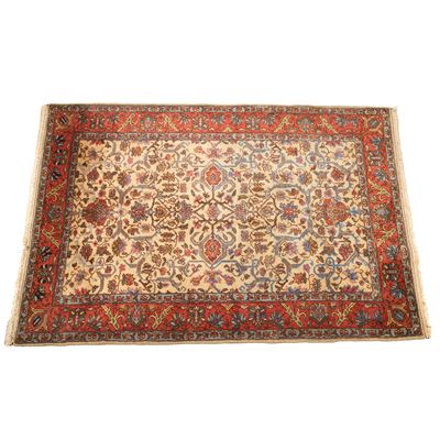 Tappeto persiano, sec. XX, fondo avana, motivo floreale con bordura rossa