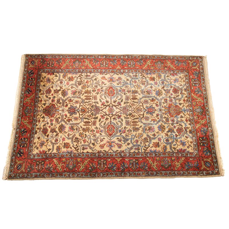 Tappeto persiano, sec. XX, fondo avana, motivo floreale con bordura rossa